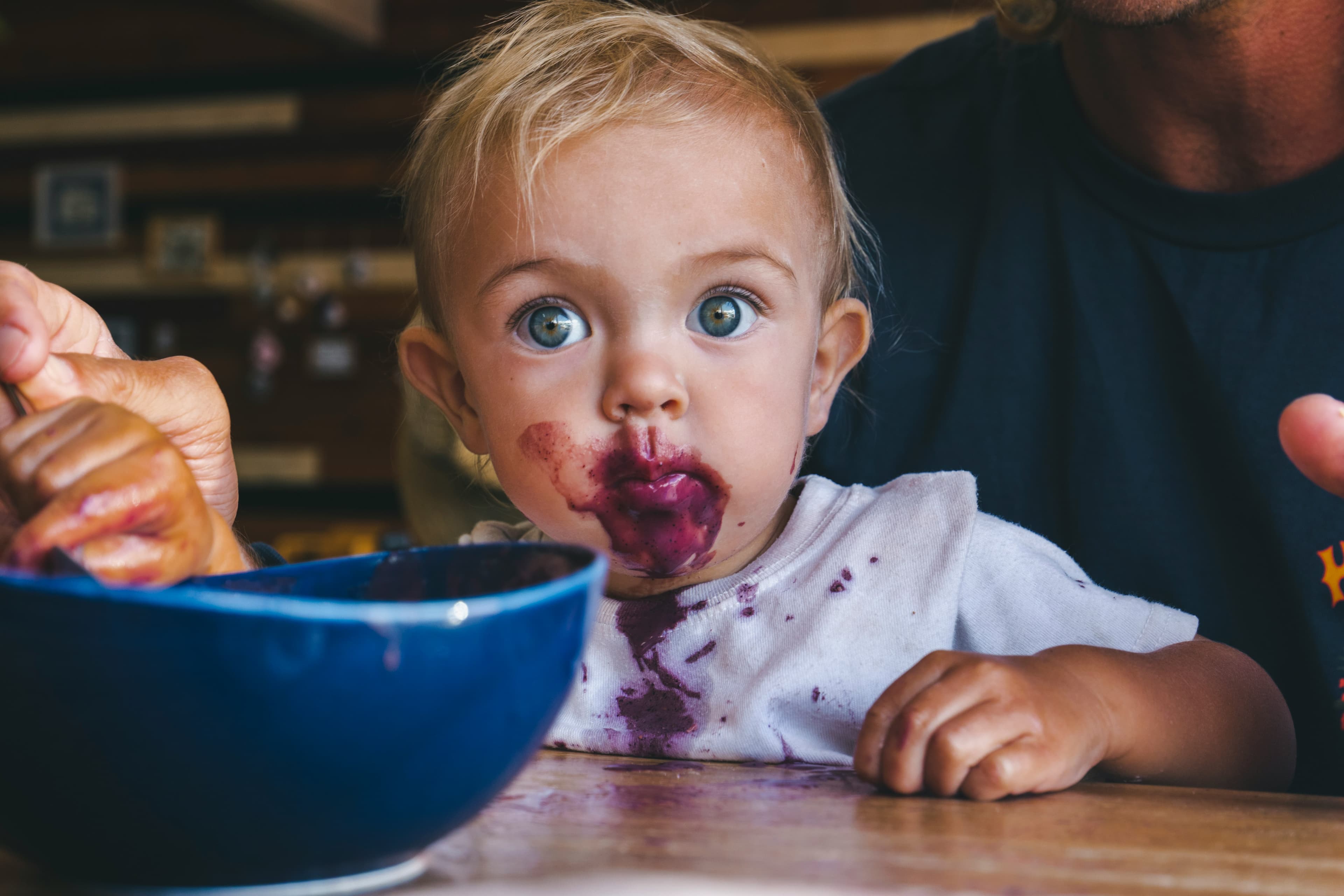 Baby with food on her face.